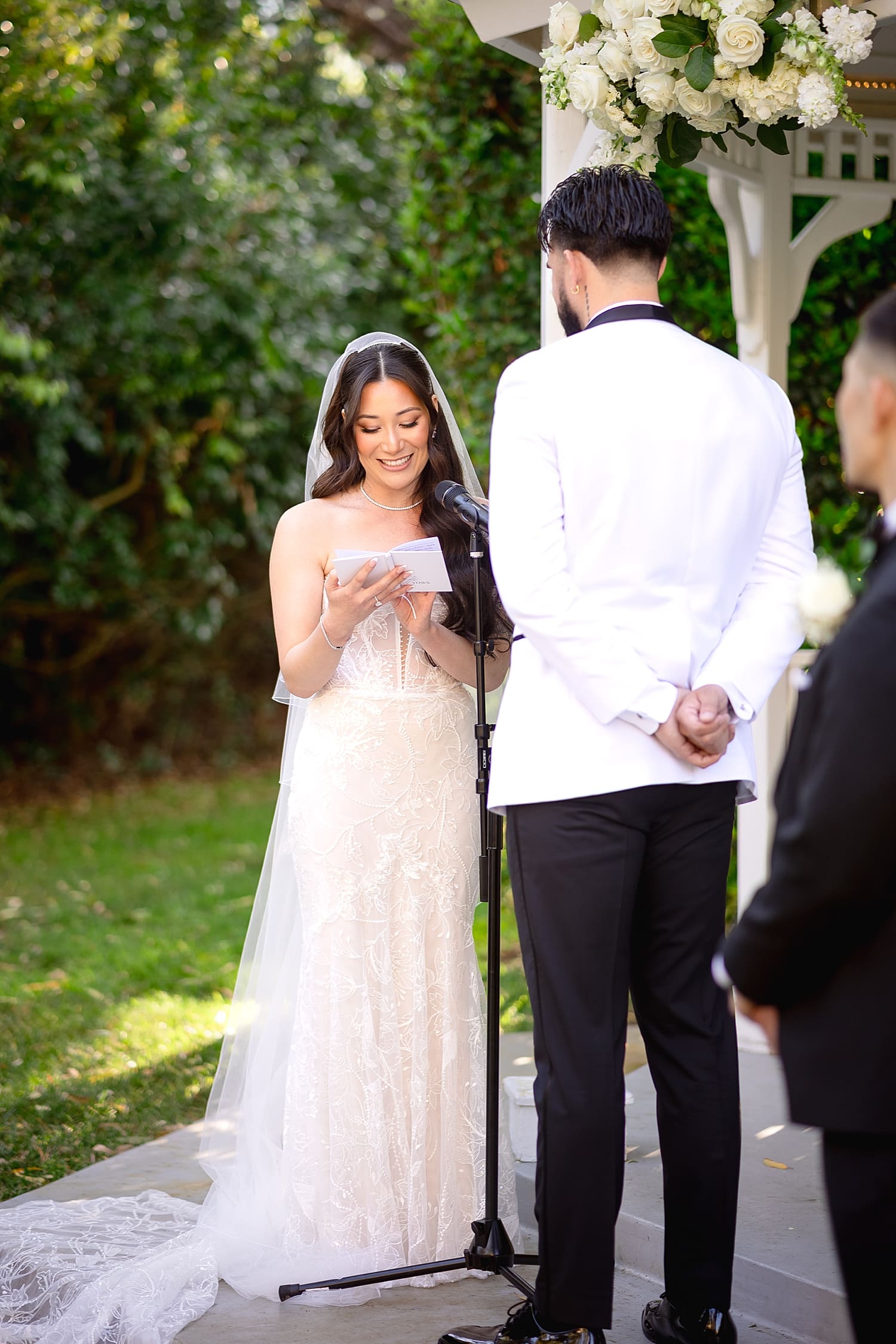 woman reads her vows at alter by Desiree Ashley Photography