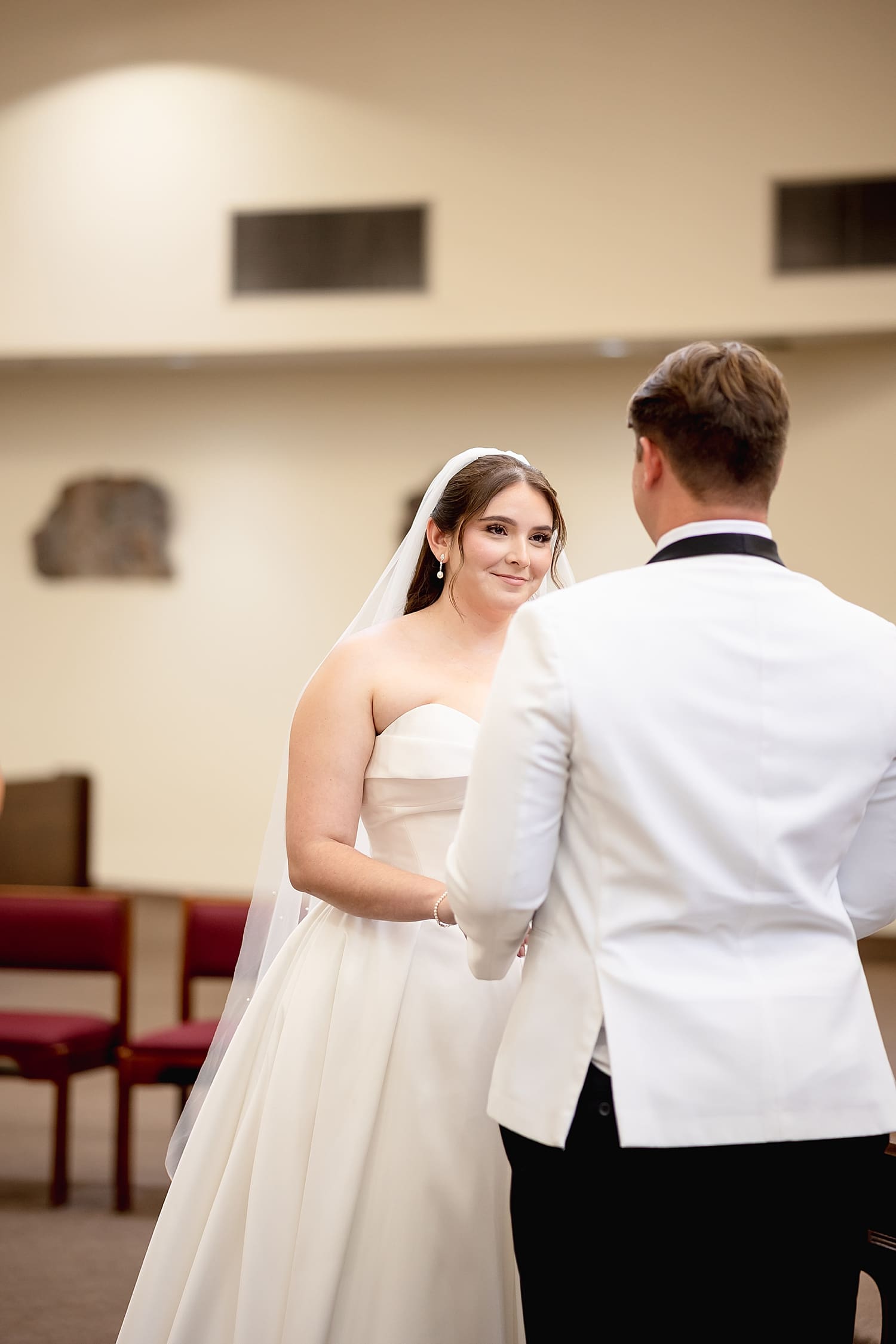 woman stands at alter with her man saying I Do by Southern California wedding photographer