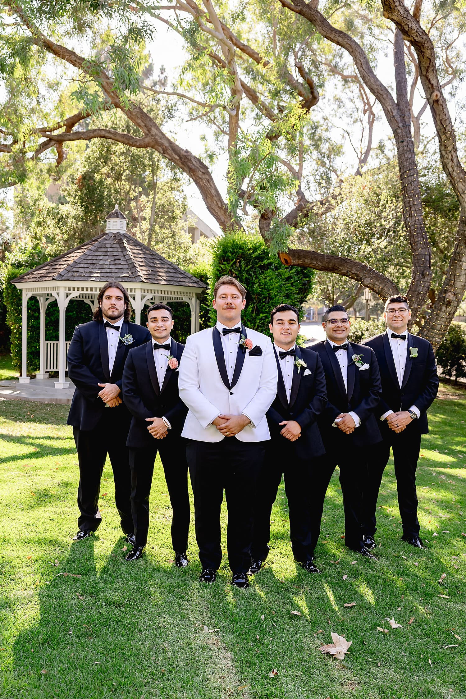 groom and his groomsmen out on the lawn by Southern California wedding photographer