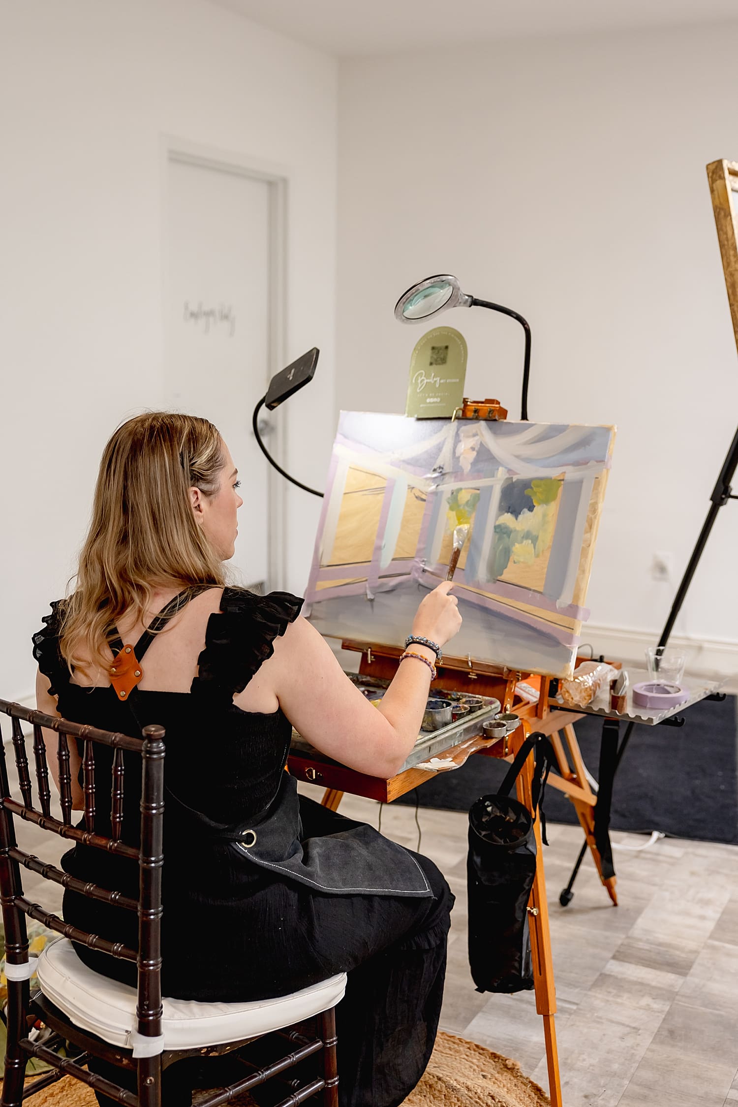 live painter works on art during reception at University Club by Wedgewood Weddings