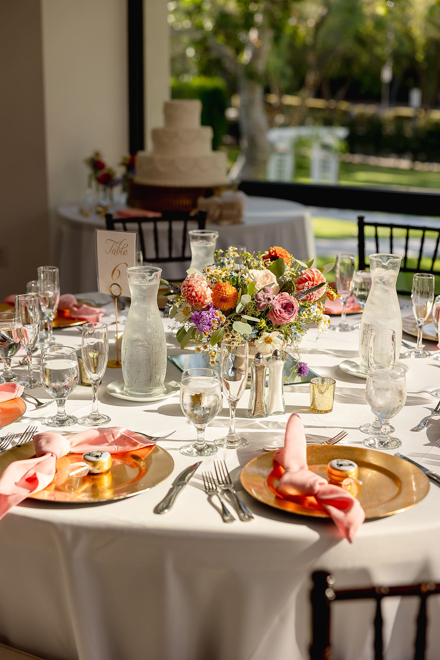 colorful flowers on top of reception table by Southern California wedding photographer