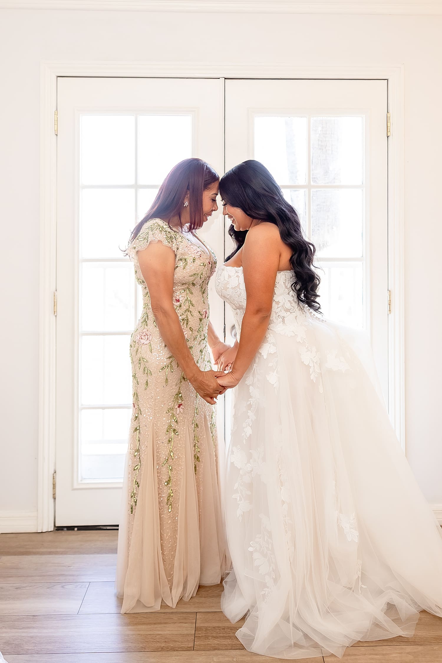 mother and daughter put their foreheads together by Southern California wedding photographer