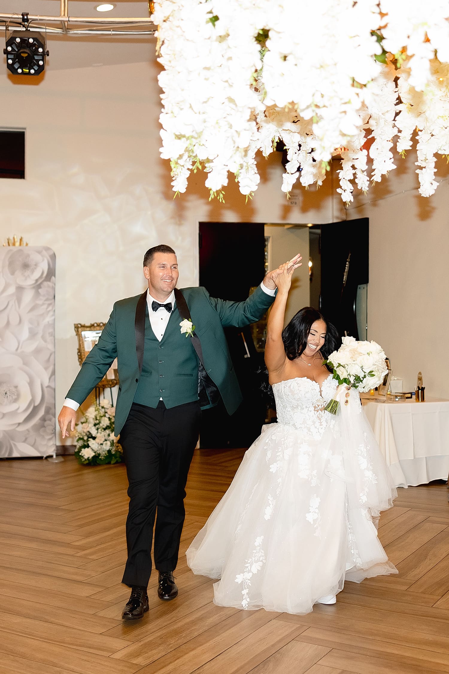 newlyweds enter reception in ballroom at Coco Palm Restaurant