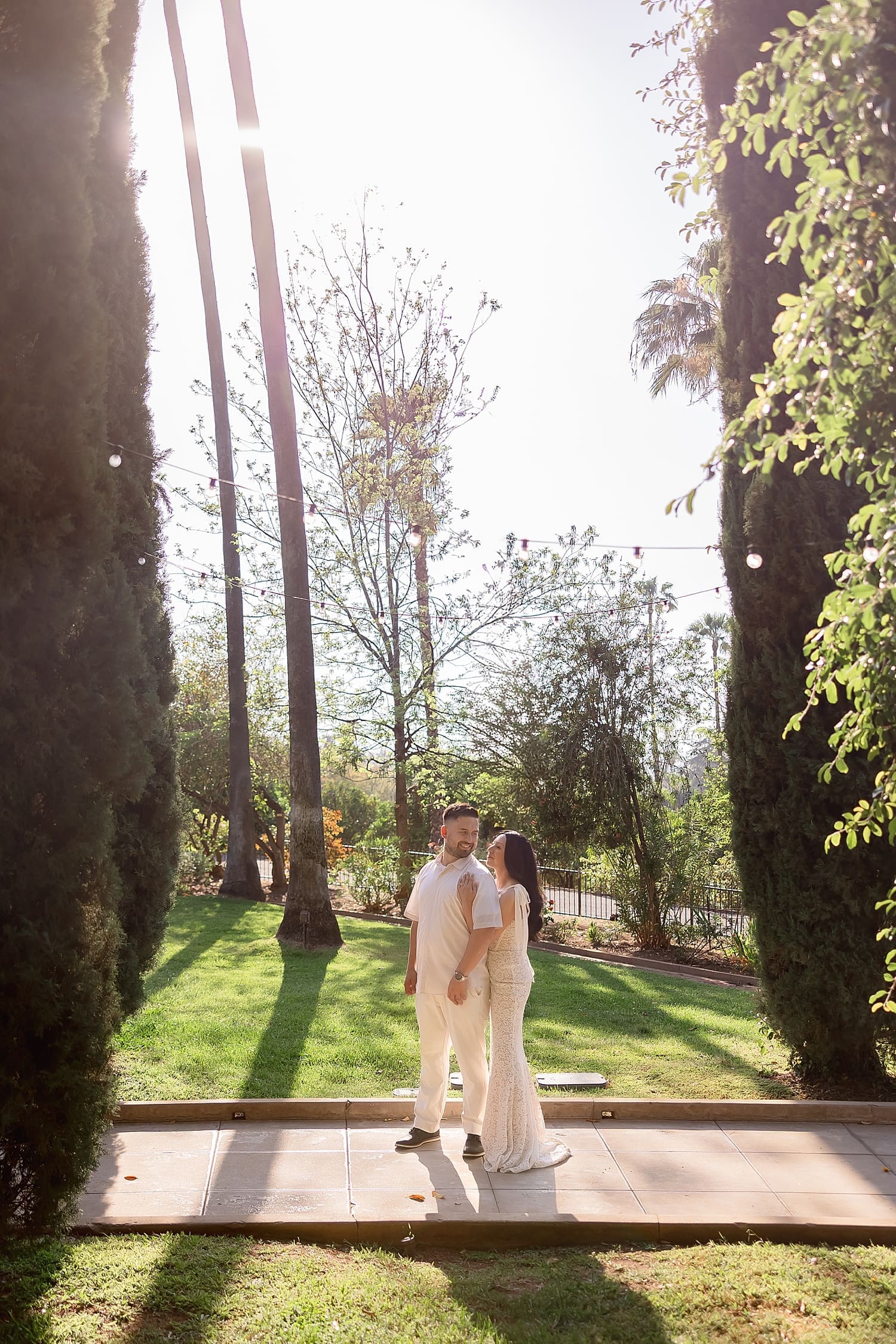 woman snuggles up to man wearing white at Kimberly Crest House & Gardens
