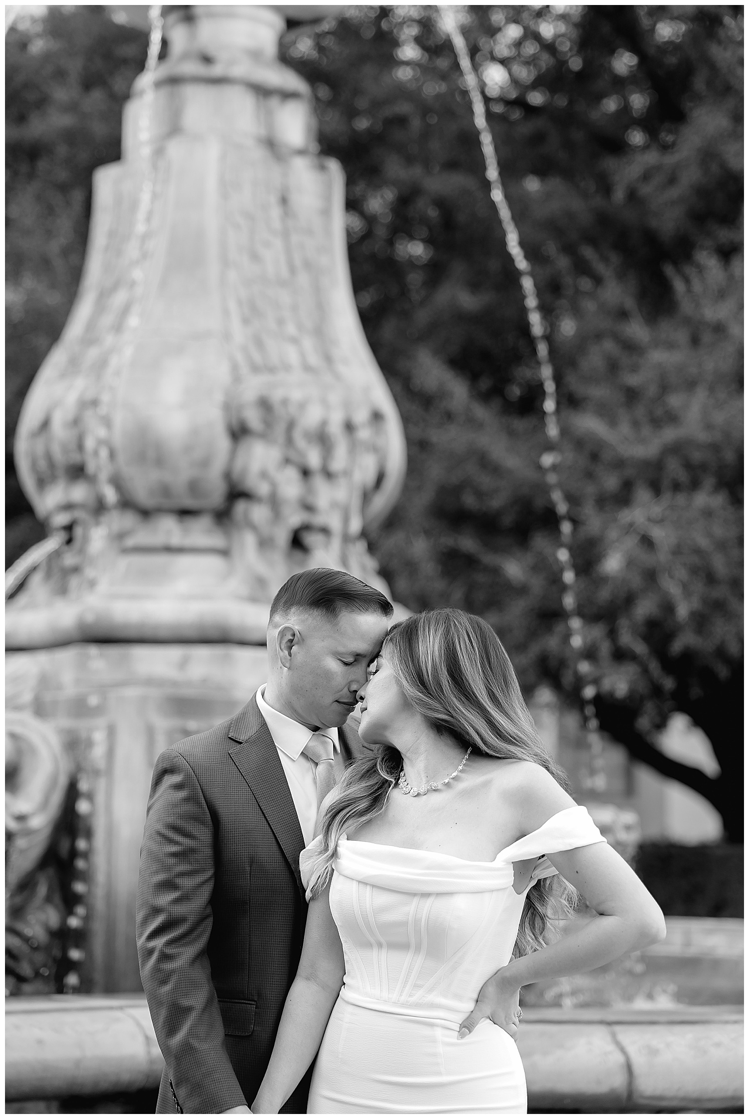 couple lean into embrace after learning how to prepare for your engagement session
