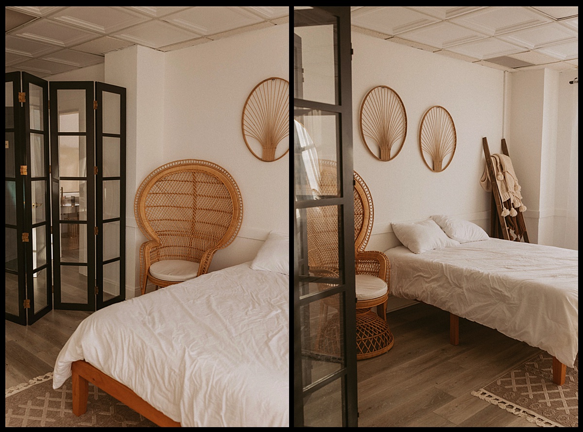 white bed set up in studio space by Photos by Dee