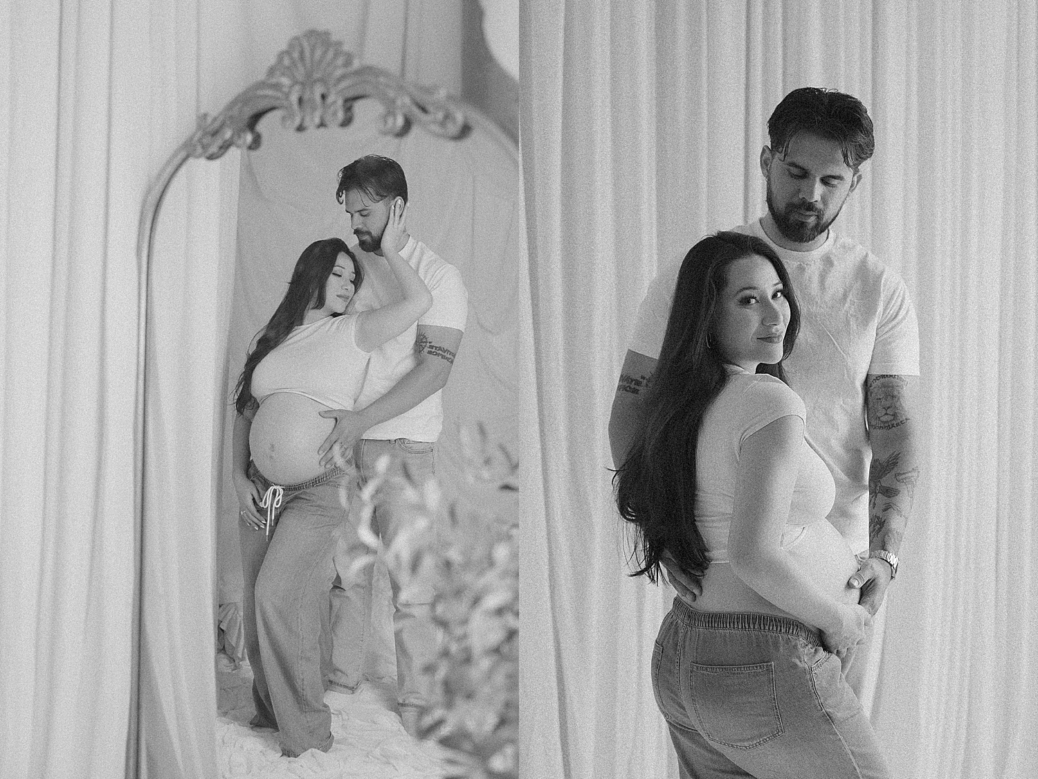 man holds his expecting wife in front of mirror for studio maternity session