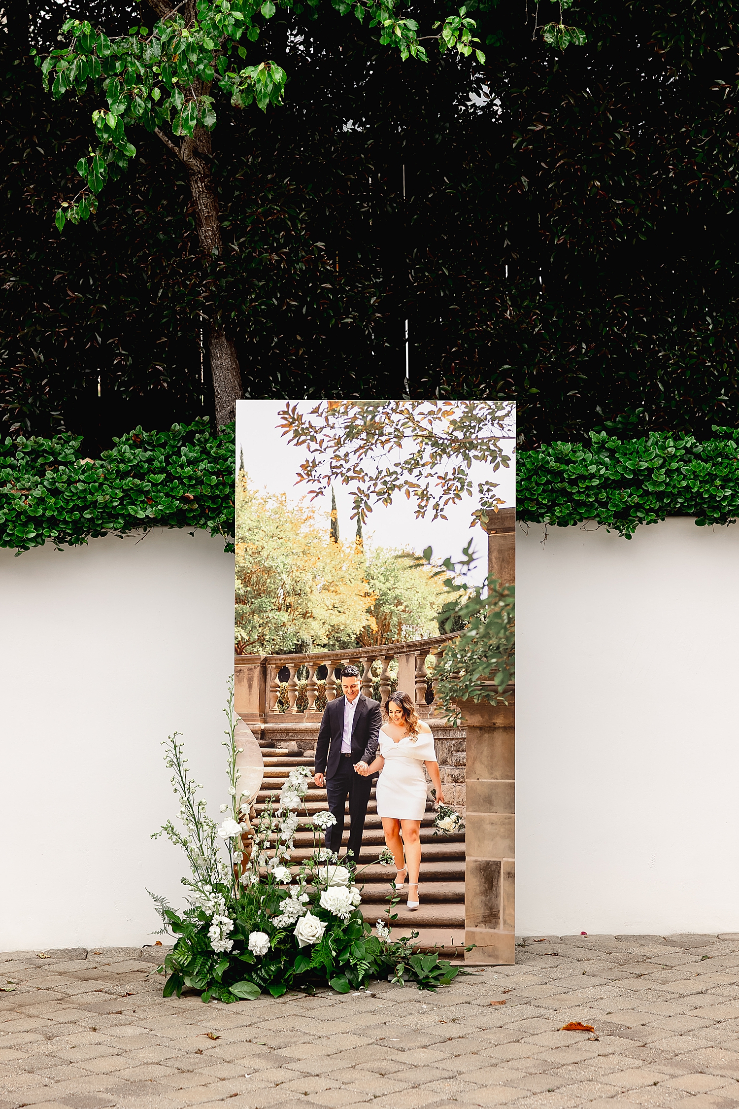 a large 6 foot poster at wedding showing are engagement photos worth it