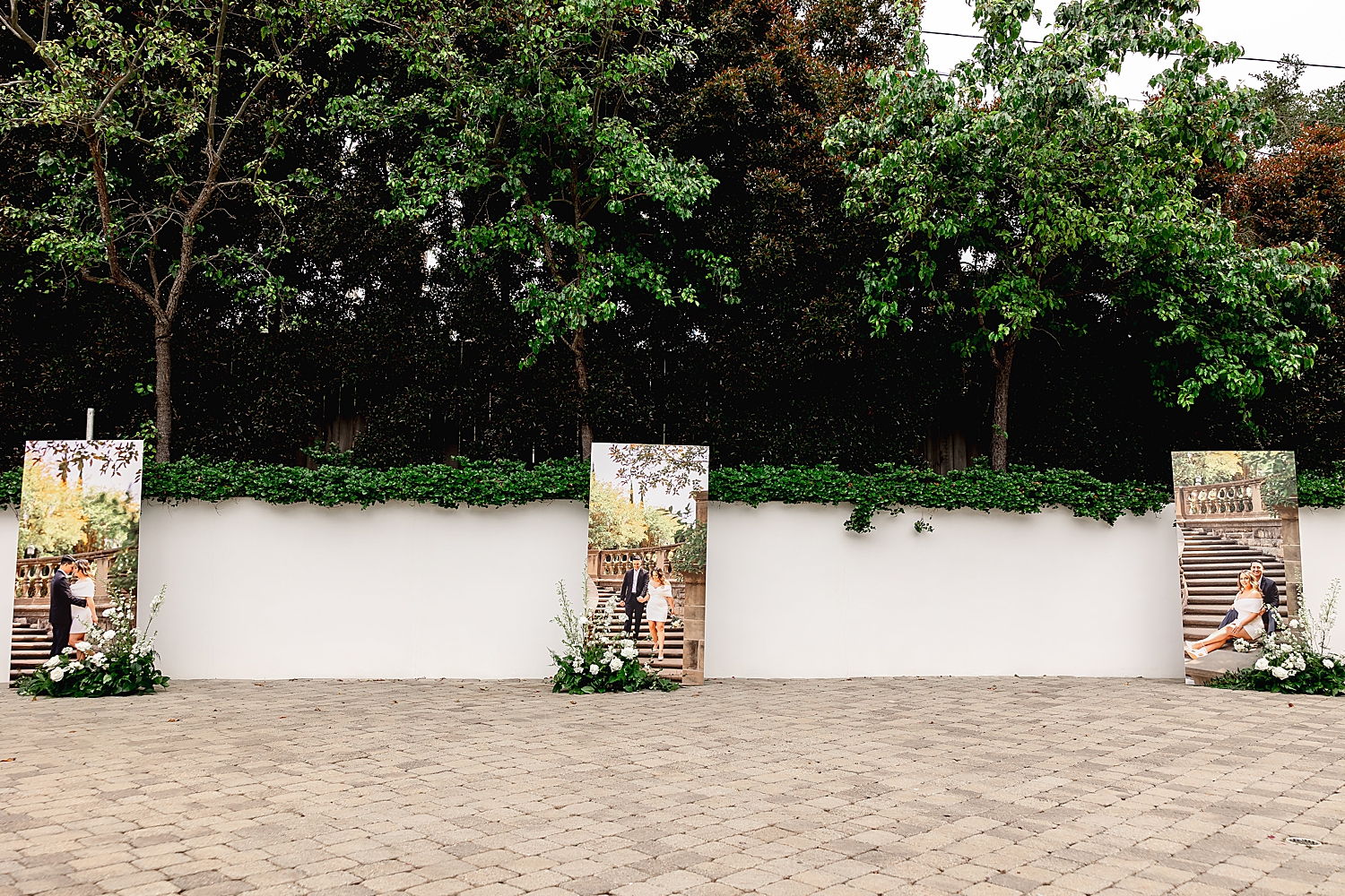 large poster of engaged couple in courtyard by Southern California wedding photographer